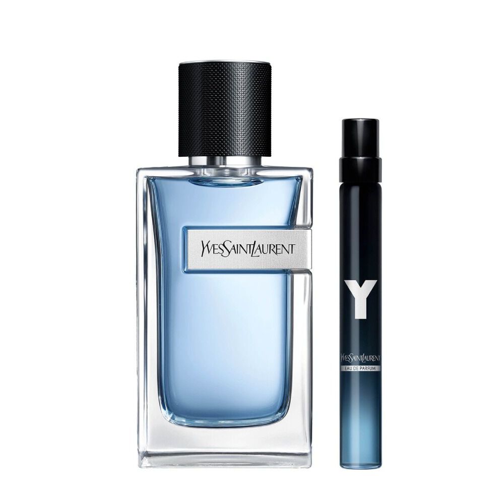YSL Y Eau de Toilette 100 ml bottle with blue gradient glass beside a matching 10 ml travel spray on a white background.