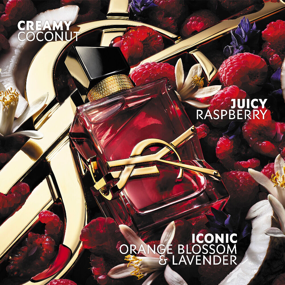 Libre Berry Crush red perfume bottle with gold YSL Cassandre logo surrounded by raspberries and flowers, with note callouts for creamy coconut, juicy raspberry, and orange blossom & lavender.