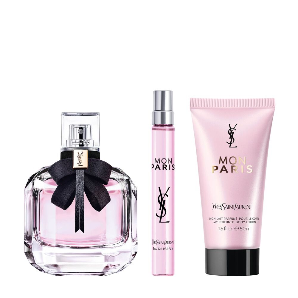 Mon Paris Eau de Parfum bottle with black bow beside a 10 ml travel spray and Mon Paris body lotion tube (50 ml) on a white background.