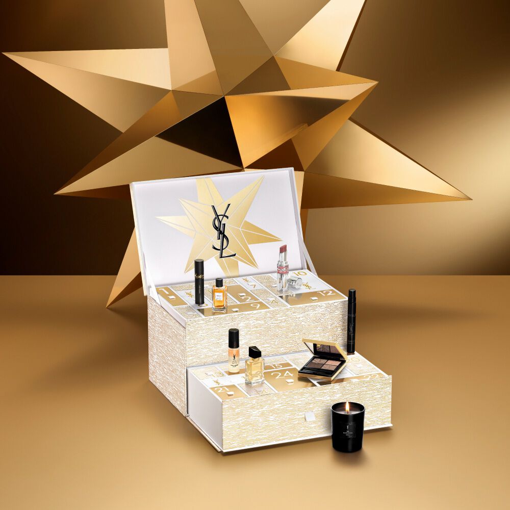 Holiday Advent Calendar open with included YSL Beauty luxury products displayed in front, with no background.