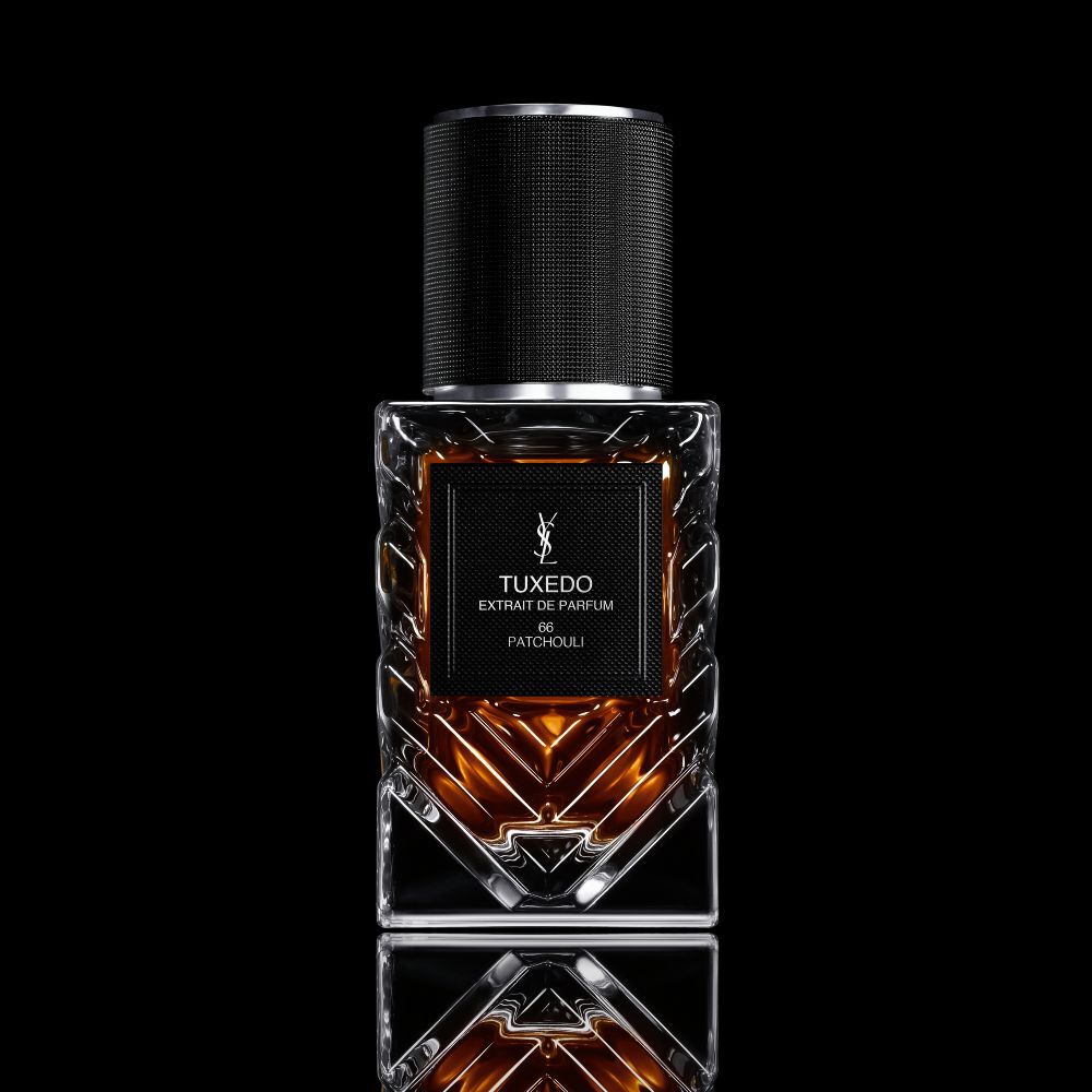 YSL LVDP Tuxedo Extrait de Parfum 66 Patchouli, a luxurious 50ml bottle on a reflective black background.