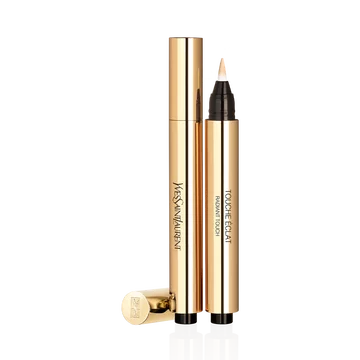 YSL Touche Eclat Radiant Touch in gold pen applicator, open with product on brush, cap beside it.