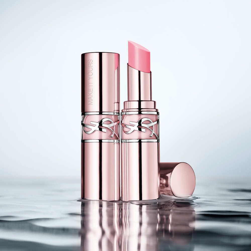 YSL LOVESHINE CANDY GLOW lip balm packshot with pale pink and silver Cassandre packaging.