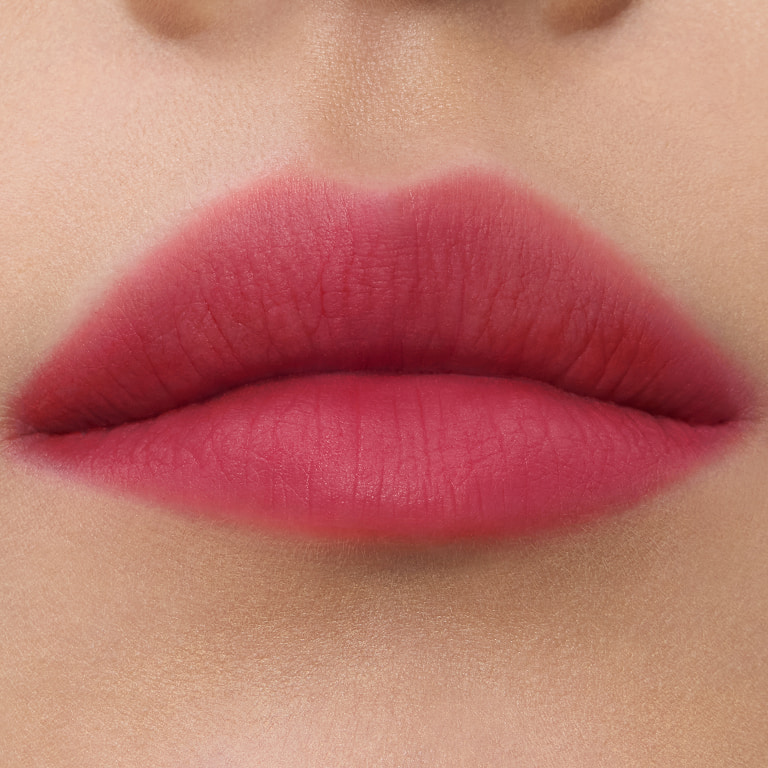 Close-up lip swatches of YSL smoked blur color stains in shades #234 Berry Satisfaction.