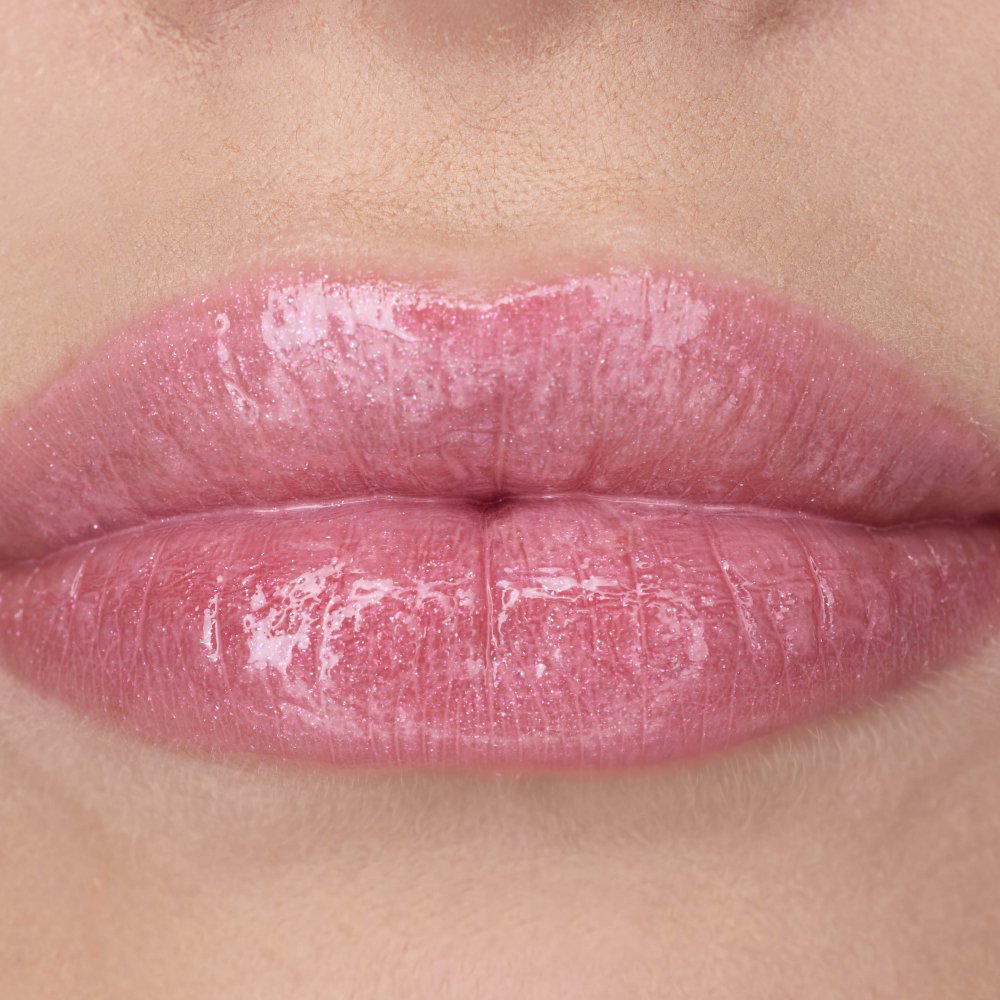 Nessie's lips wearing YSL LOVESHINE Lipstick in shade 10 Stardust
Love, a glossy pink.