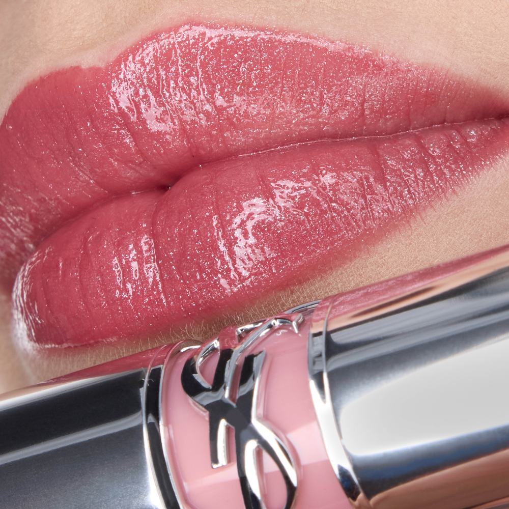 Nessie's lips wearing YSL LOVESHINE Lipstick in shade 215, a
shimmery pink, with the lipstick tube.
