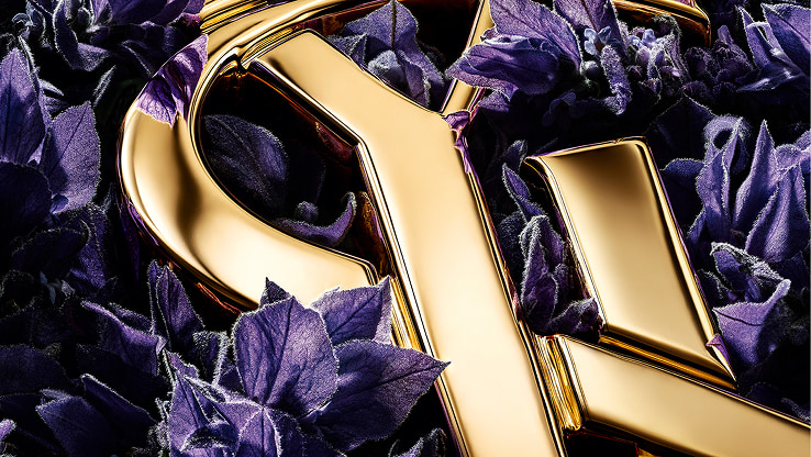 YSL LIBRE gold Cassandre logo amidst purple
lavender, highlighting the fragrance's key ingredient.