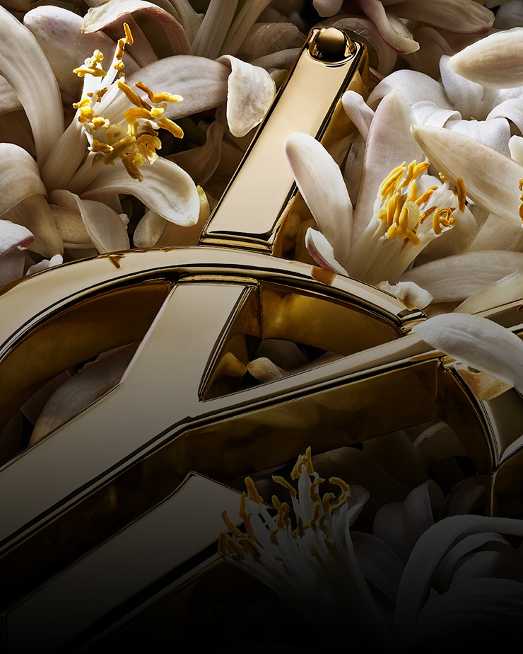 Golden YSL Cassandre with white orange blossoms.