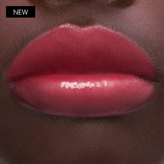 YSL LOVESHINE CANDY GLOW lip balm shade Berry Lolly worn on lips with glossy candy-like shine.