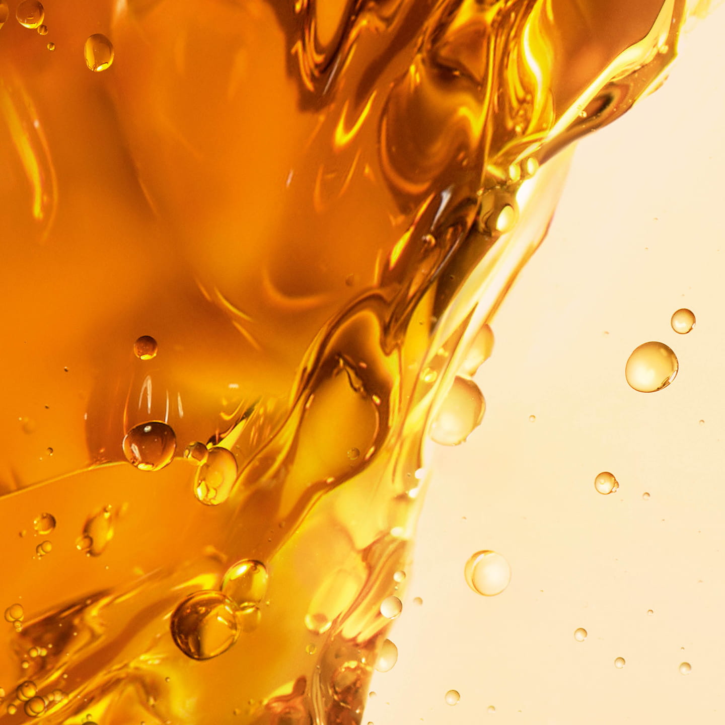 YSL Pure Shots Night Reboot Serum's bi-phase texture, showing two
distinct golden liquids with bubbles, for optimal efficacy.