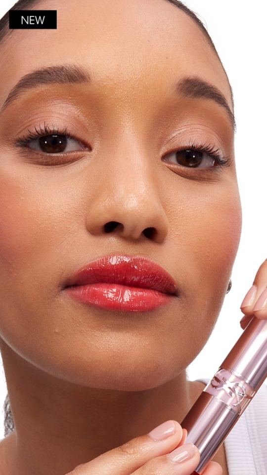 Model wearing YSL LOVESHINE CANDY GLOW lip balm with high-shine candy gloss finish.