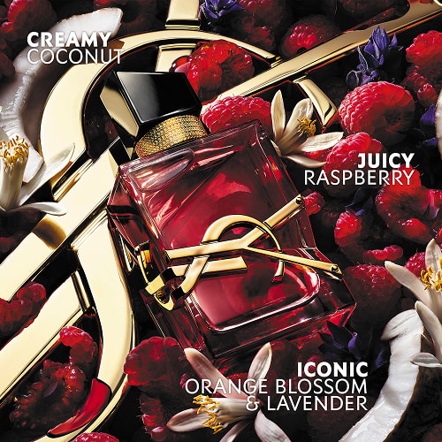 Libre Berry Crush red perfume bottle with gold YSL Cassandre logo surrounded by raspberries and flowers, with note callouts for creamy coconut, juicy raspberry, and orange blossom & lavender.