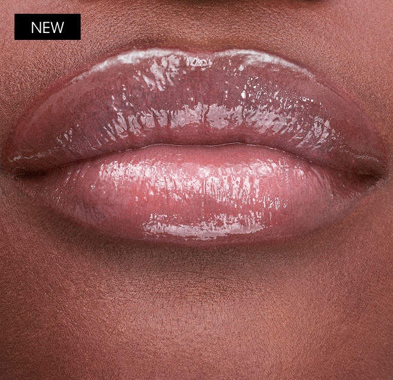 Lips wearing YSL LOVESHINE CANDY GLAZE shade Bubble Gum with glossy finish.