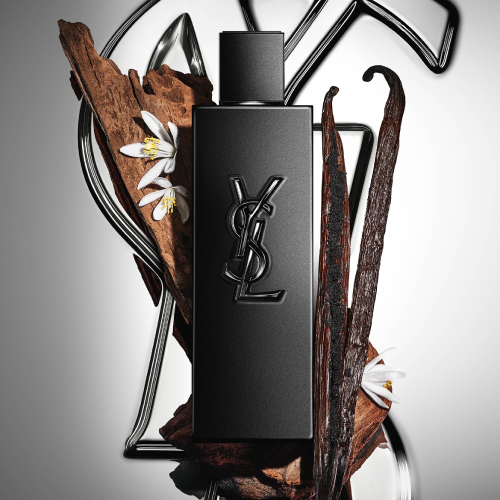 MYSLF Le Parfum matte black bottle by YSL Beauty surrounded by vanilla pods, orange blossom and woods.