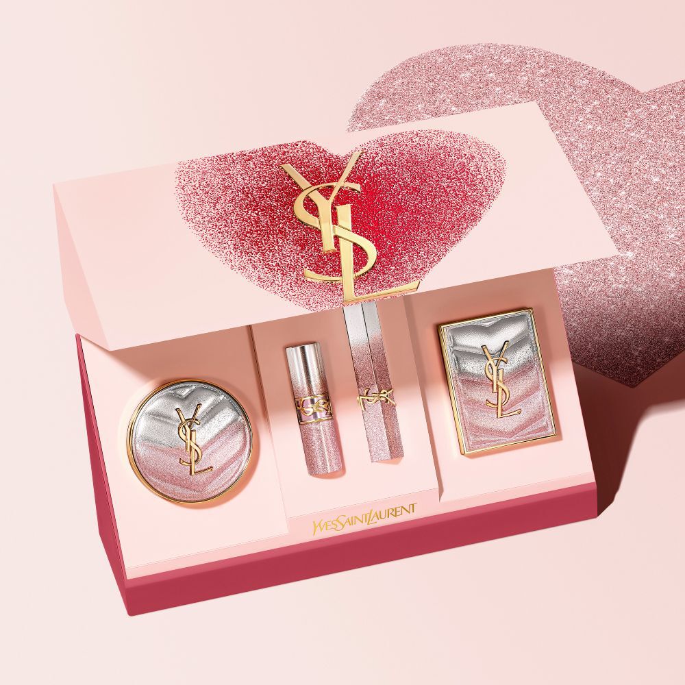 YSL Beauty Valentine's day makeup set in a heart-shaped box, featuring a cushion compact, lipstick, and eyeshadow palette.