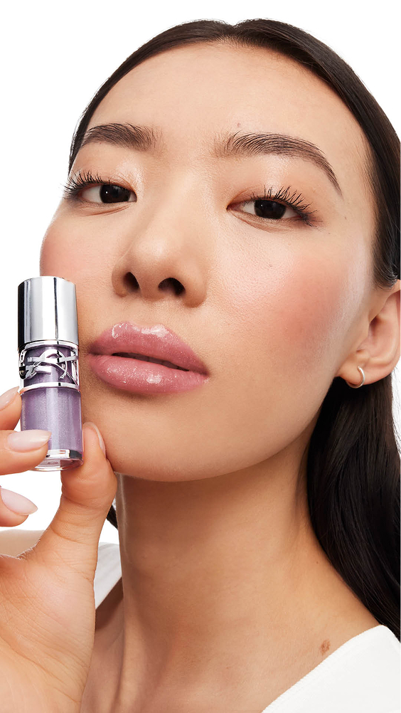 Song, light-skinned, with YSL LOVESHINE Plumping Gloss in Shade 1 Thunder Stealer, showcasing glossy lips.