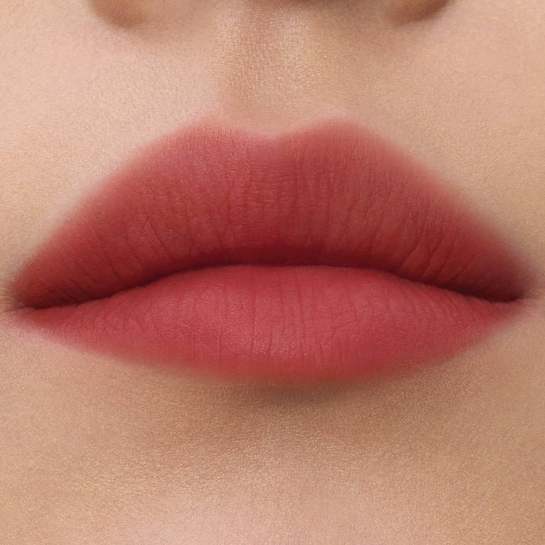 Close-up lip swatches of YSL smoked blur color stains in shades #239 Sunset Hotline.