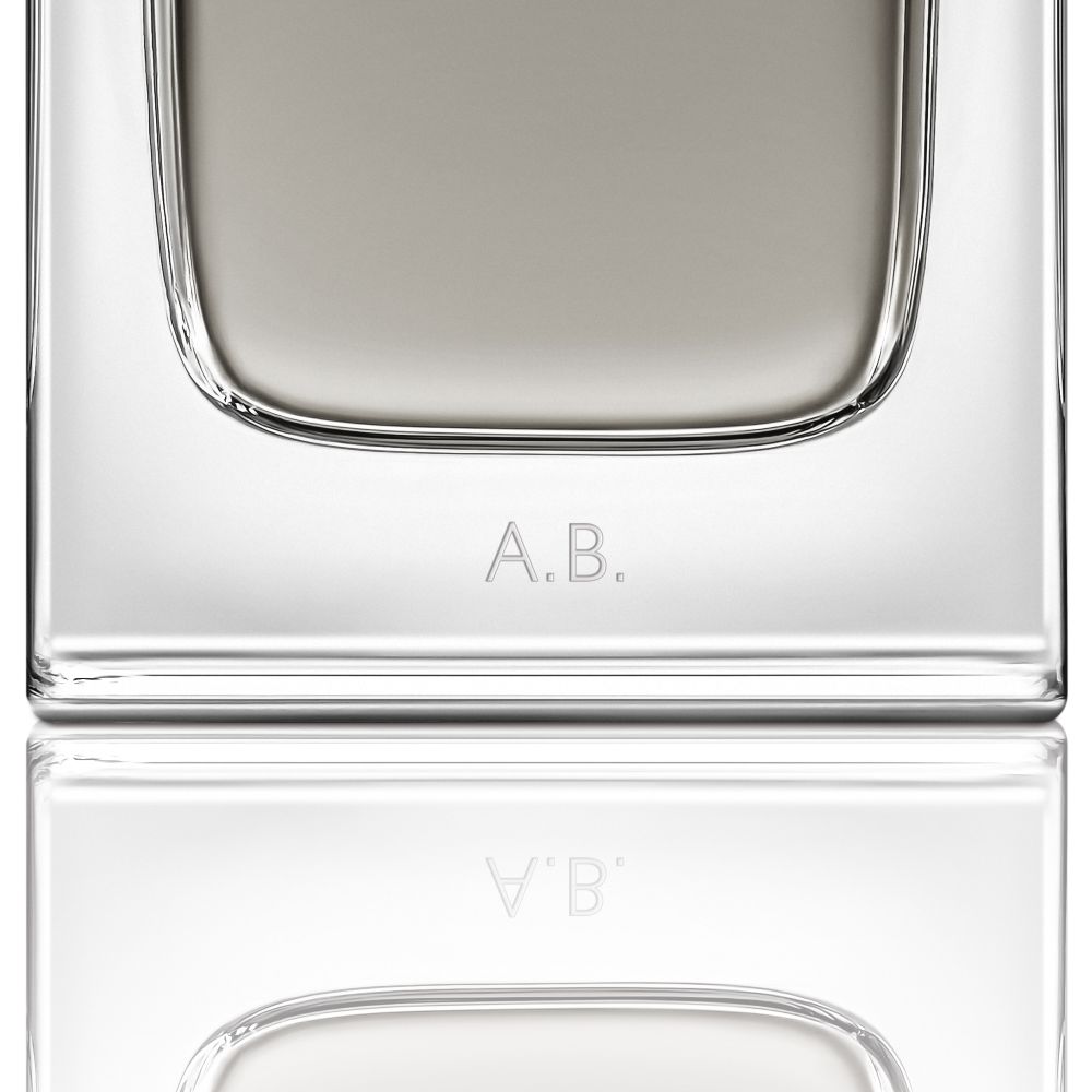 Close-up of the MYSLF Eau de Toilette Intense bottle base featuring personalized A.B. initials engraving.