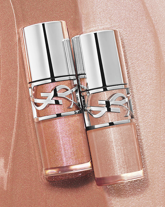 Two YSL LOVESHINE Plumping Lip Oil Glosses, shades 12 and 10, on a shimmering textured background.