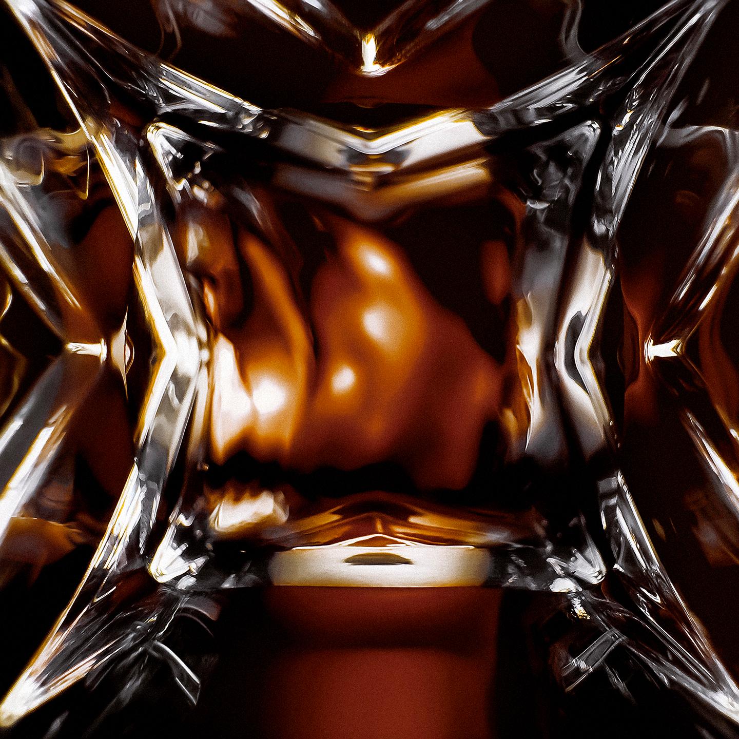 YSL LVDP Tuxedo Extrait de Parfum bottle, extreme close-up of
the intricate glass design with luminous reflections.